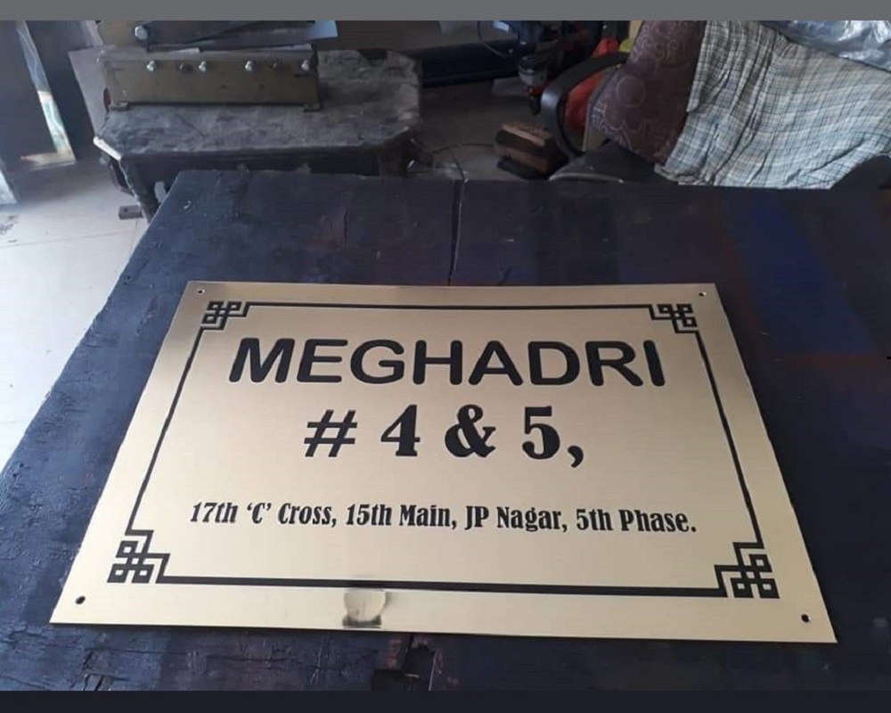 SS Corporate Nameplate at Desk